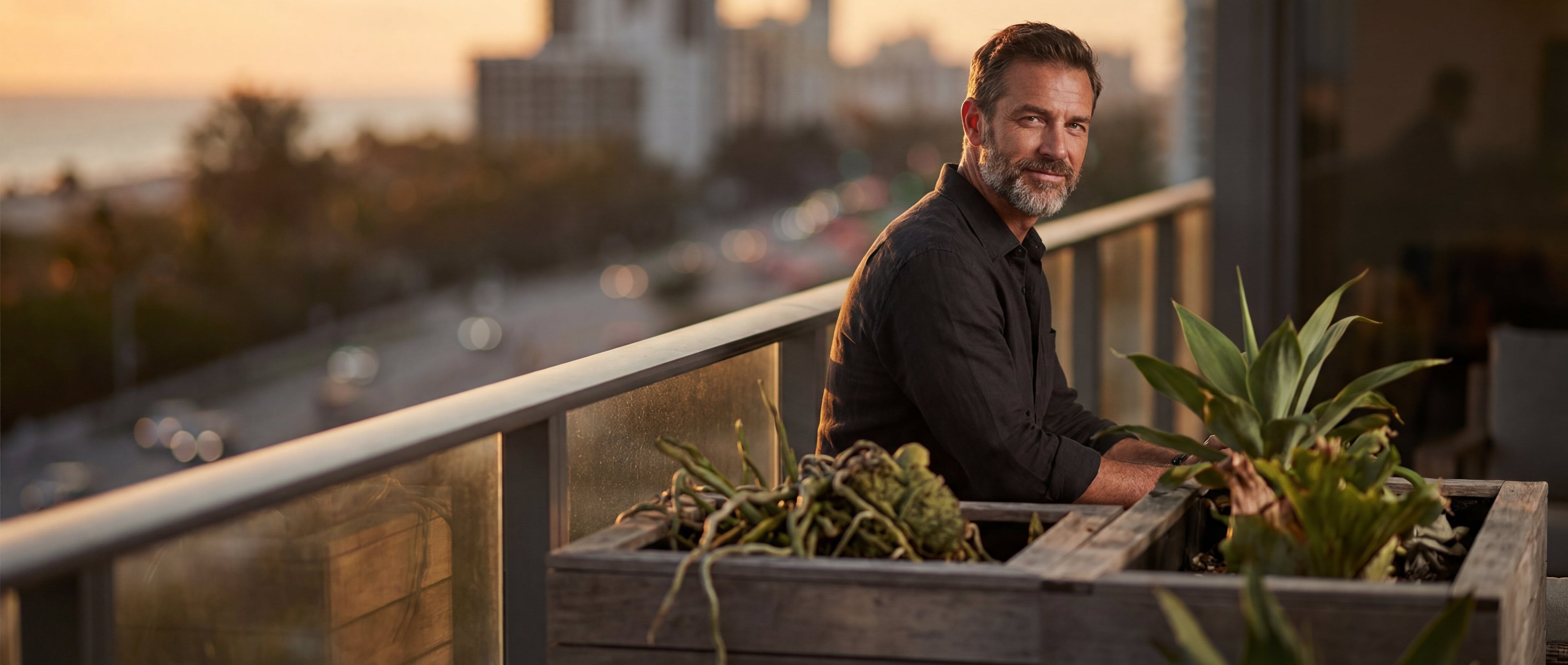 Confident middle-aged man at sunset representing long-lasting natural sexual enhancement and sustained performance support